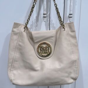 Authentic Love Moschino shoulder bag with signature heart-lock hardware.